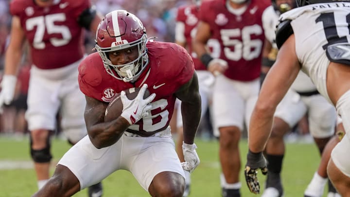 Oct 4, 2025; Tuscaloosa, Alabama, USA;  Alabama running back Jam Miller (26) runs the ball as Vanderbilt linebacker Langston Patterson (10) closes at Saban Field at Bryant-Denny Stadium. Alabama downed Vanderbilt 30-14. Mandatory Credit: Gary Cosby Jr.-Imagn Images