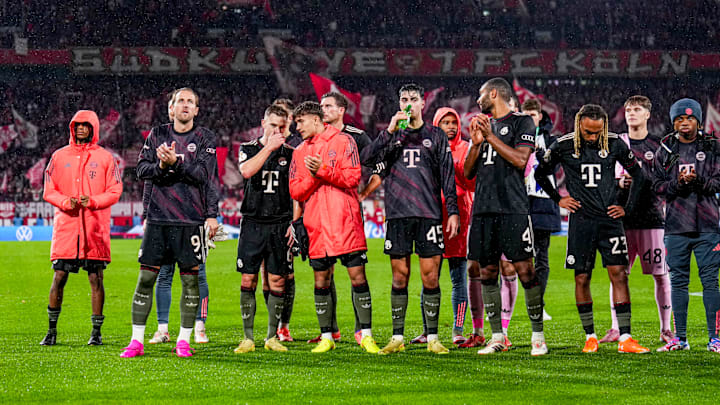 Bayern Munich players celebrating win against FC Koln with the travelling fans. Bayern Munich players celebrating win against FC Koln with the travelling fans.