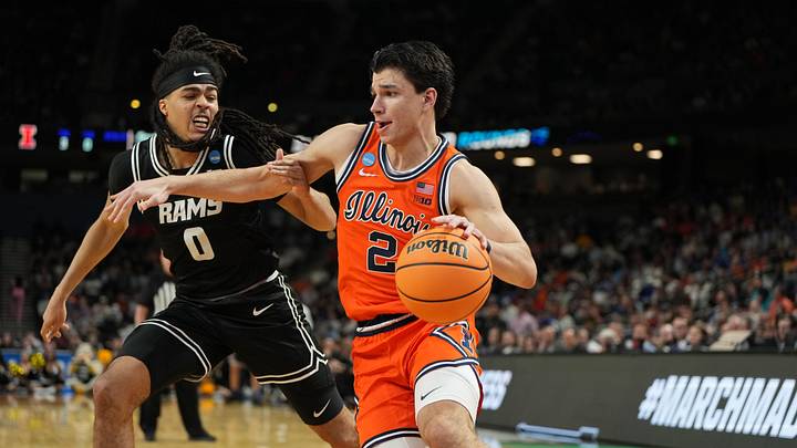 Mar 21, 2026; Greenville, SC, USA; VCU Rams guard Brandon Jennings (0) defends against Illinois Fighting Illini guard Andrej Stojakovic (2) during the second half during a second round game of the men's 2026 NCAA Tournament at Bon Secours Wellness Arena. Mandatory Credit: Bob Donnan-Imagn Images