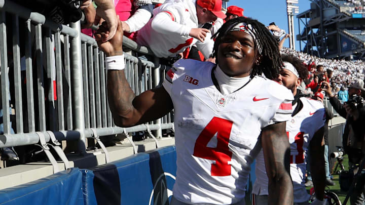 Nov 2, 2024; University Park, Pennsylvania, USA; Ohio State Buckeyes wide receiver Jeremiah Smith (4) shakes the hand of a fan following the game against the Penn State Nittany Lions at Beaver Stadium. Mandatory Credit: Matthew O'Haren-Imagn Images Nov 2, 2024; University Park, Pennsylvania, USA; Ohio State Buckeyes wide receiver Jeremiah Smith (4) shakes the hand of a fan following the game against the Penn State Nittany Lions at Beaver Stadium. Mandatory Credit: Matthew O'Haren-Imagn Images