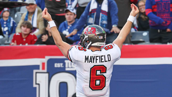 Nov 24, 2024; East Rutherford, New Jersey, USA; Tampa Bay Buccaneers quarterback Baker Mayfield (6) gestures after scoring a rushing touchdown during the first half against the New York Giants at MetLife Stadium. Mandatory Credit: Vincent Carchietta-Imagn Images Nov 24, 2024; East Rutherford, New Jersey, USA; Tampa Bay Buccaneers quarterback Baker Mayfield (6) gestures after scoring a rushing touchdown during the first half against the New York Giants at MetLife Stadium. Mandatory Credit: Vincent Carchietta-Imagn Images
