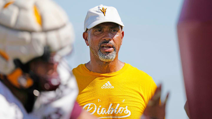 ASU defensive line coach Diron Reynolds instructs his players in a drill during an ASU practice on Aug. 16, 2024, in Tempe.