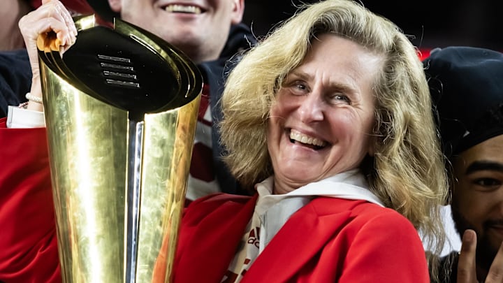 Jan 19, 2026; Miami Gardens, FL, USA; Indiana Hoosiers president Dr. Pamela Whitten celebrates with the trophy after defeating the Miami Hurricanes in the College Football Playoff National Championship game at Hard Rock Stadium. Jan 19, 2026; Miami Gardens, FL, USA; Indiana Hoosiers president Dr. Pamela Whitten celebrates with the trophy after defeating the Miami Hurricanes in the College Football Playoff National Championship game at Hard Rock Stadium.