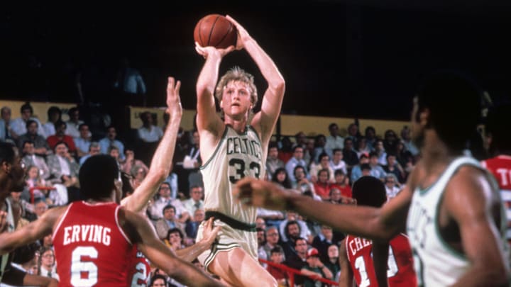 Unknown date; Boston, MA, USA; FILE PHOTO; Boston Celtics forward Larry Bird (33) shoots over Philadelphia 76ers forward Julius Erving (back) battle for position at the Boston Garden. 