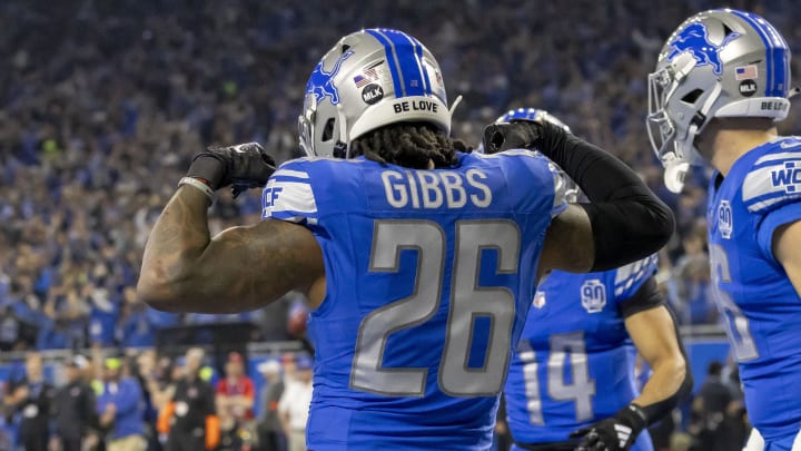 Jan 14, 2024; Detroit, Michigan, USA; Detroit Lions running back Jahmyr Gibbs (26) celebrates after a touchdown during the first half of a 2024 NFC wild card game against the Los Angeles Rams at Ford Field. Mandatory Credit: David Reginek-USA TODAY Sports