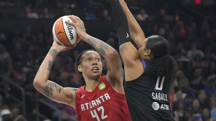 Atlanta Dream center Brittney Griner (42) is defended by Phoenix Mercury forward Satou Sabally (0) during the first quarter at PHX Arena Jul 23, 2025.
