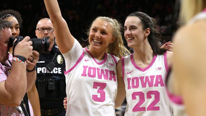 Iowa's Sydney Affolter (3) and Caitlin Clark (22) react after defeating Illinois Saturday, Feb. 24, 2024 at Carver-Hawkeye Arena.