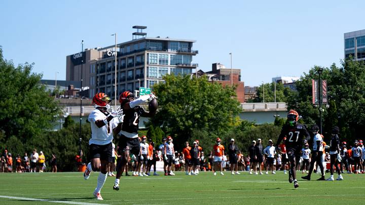 Cincinnati Bengals cornerback Dax Hill (23) knocks a pass away from Cincinnati Bengals wide receiver Ja'Marr Chase (1) during the Cincinnati Bengals Training Camp 2026 at Kettering Practice Field in Cincinnati on Thursday, July 30, 2026. Cincinnati Bengals cornerback Dax Hill (23) knocks a pass away from Cincinnati Bengals wide receiver Ja'Marr Chase (1) during the Cincinnati Bengals Training Camp 2026 at Kettering Practice Field in Cincinnati on Thursday, July 30, 2026.