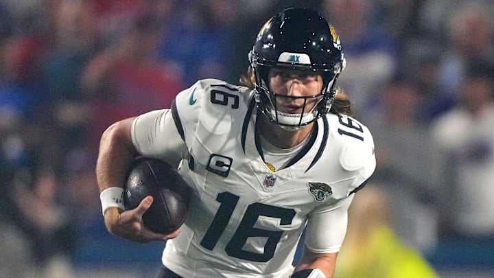 Sep 23, 2024; Orchard Park, New York, USA; Jacksonville Jaguars quarterback Trevor Lawrence (16) runs against the Buffalo Bills during the first half at Highmark Stadium. Mandatory Credit: Gregory Fisher-Imagn Images
