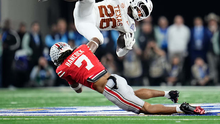 Ohio State Buckeyes cornerback Jordan Hancock (7) tackles Texas Longhorns running back Quintrevion Wisner (26) during the second half of the Cotton Bowl Classic College Football Playoff semifinal game Ohio State Buckeyes cornerback Jordan Hancock (7) tackles Texas Longhorns running back Quintrevion Wisner (26) during the second half of the Cotton Bowl Classic College Football Playoff semifinal game