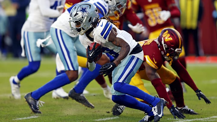 Nov 24, 2024; Landover, Maryland, USA; Dallas Cowboys wide receiver KaVontae Turpin (9) breaks a tackle by Washington Commanders safety Jeremy Reaves (39) to run for a touchdown on a kickoff return during the fourth quarter at Northwest Stadium. Mandatory Credit: Peter Casey-Imagn Images