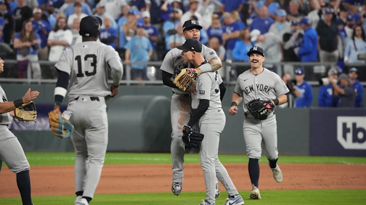 Oct 10, 2024; Kansas City, Missouri, USA; The New York Yankees celebrate clinching the American League Divisional Series over the Kansas City Royals during game four of the ALDS for the 2024 MLB Playoffs at Kauffman Stadium. Mandatory Credit: Denny Medley-Imagn Images