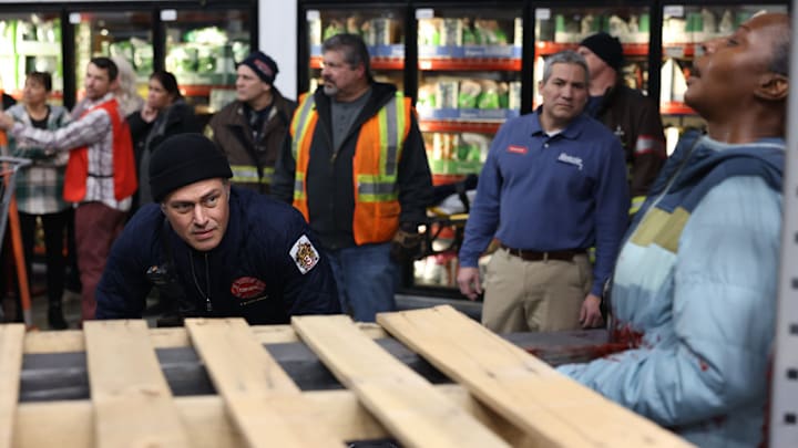 CHICAGO FIRE -- "Trapped" Episode 12003 -- Pictured: (l-r) Taylor Kinney as Kelly Severide, TC Rose as victim -- (Photo by: Adrian S Burrows Sr/NBC)