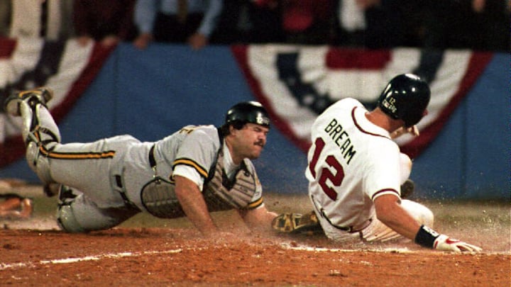The Atlanta Braves Sid Bream (R) slides across the