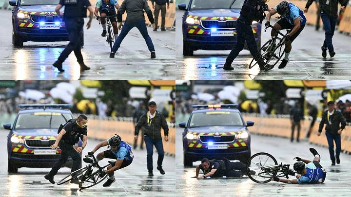 Momento en el que es derribado el hombre que no participaba en la etapa del Tour de Francia. Momento en el que es derribado el hombre que no participaba en la etapa del Tour de Francia.