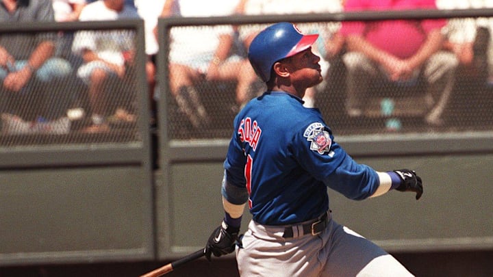 Chicago Cubs outfielder Sammy Sosa hits his 52nd home run of the year in the third inning against the Reds at Cinergy Field.