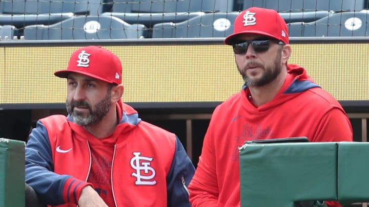 Apr 9, 2025; Pittsburgh, Pennsylvania, USA;  St. Louis Cardinals bench coach Daniel Descalso (left) and manager Oliver Marmol (right) look  on from the dugout steps against the Pittsburgh Pirates during the twelfth inning at PNC Park. Mandatory Credit: Charles LeClaire-Imagn Images
