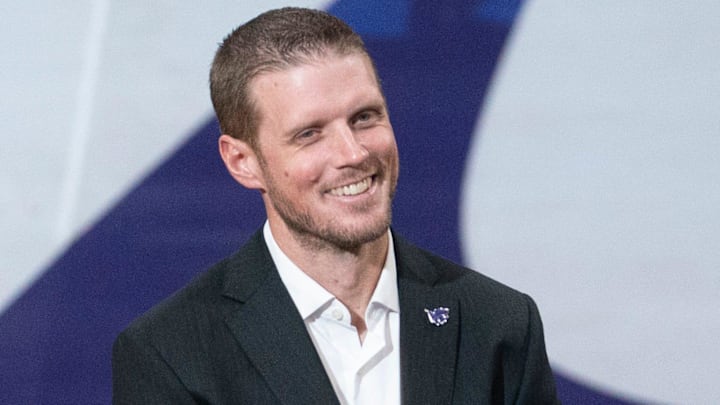 Kansas State new coach Collin Klein laughs at remarks by athletic director Gene Taylor during his introduction ceremony at Morgan Family Arena on Dec. 5, 2025.