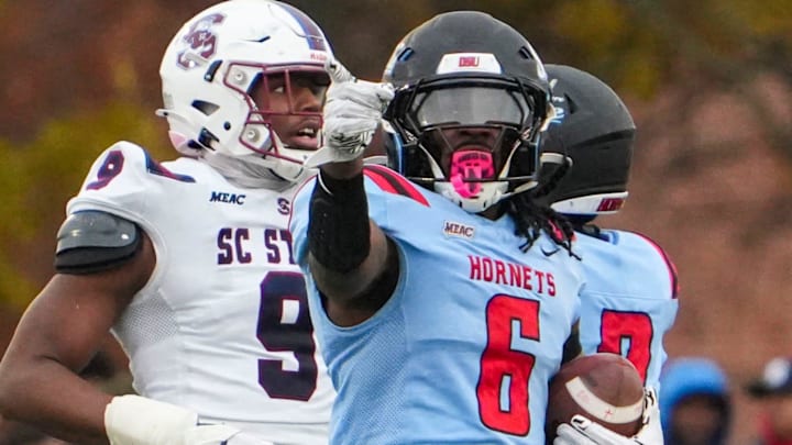 Delaware State’s Marquis Gillis celebrates a run for first down in the third quarter of the Hornets’ 28-17 loss to South Carolina State at Alumni Stadium, Nov. 22, 2025.