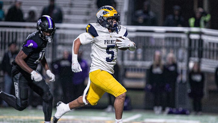 Andrew Beard of Prince Avenue breaks through the middle of Calvary's defense to score a touchdown on Nov. 29, 2024.