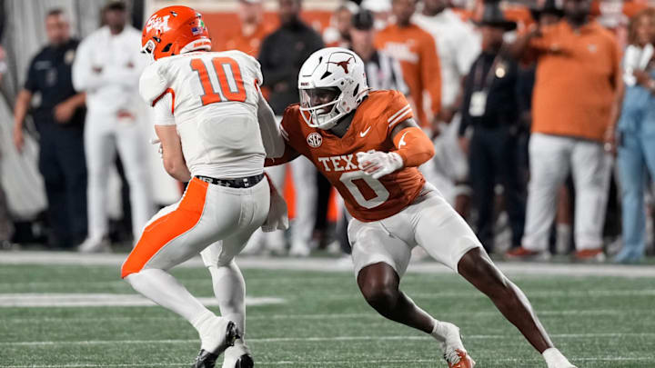 Sep 20, 2025; Austin, Texas, USA; Texas Longhorns linebacker Anthony Hill Jr (0) tackles Sam Houston Bearkats quarterback Grant Gunnell (10) during the second half at Darrell K Royal-Texas Memorial Stadium. Sep 20, 2025; Austin, Texas, USA; Texas Longhorns linebacker Anthony Hill Jr (0) tackles Sam Houston Bearkats quarterback Grant Gunnell (10) during the second half at Darrell K Royal-Texas Memorial Stadium.