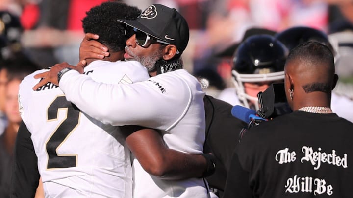 Colorado football coach Deion Sanders hugs his son, Shedeur Sanders, before facing Texas Tech in a Big 12 football game Saturday, Nov. 9, 2024, at Jones AT&T Stadium. Colorado football coach Deion Sanders hugs his son, Shedeur Sanders, before facing Texas Tech in a Big 12 football game Saturday, Nov. 9, 2024, at Jones AT&T Stadium.