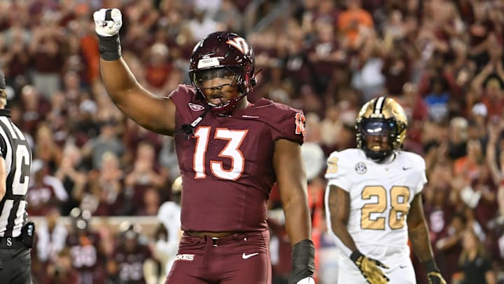 Sep 6, 2025; Blacksburg, Virginia, USA; Virginia Tech Hokies defensive lineman Kemari Copeland (13) celebrates a defensive stop during the first quarter at Lane Stadium. Mandatory Credit: Brian Bishop-Imagn Images
