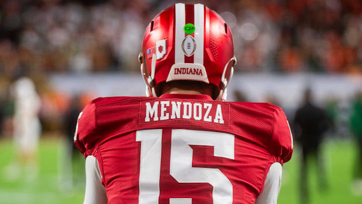 Indiana's Fernando Mendoza (15) gets loose before the College Football Playoff National Championship college football game at Hard Rock Stadium in Miami Gardens on Monday, Jan. 19, 2026.