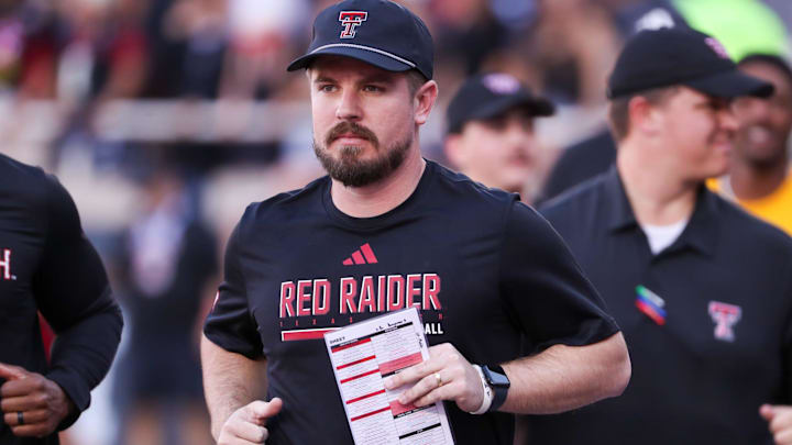Texas Tech offensive coordinator Mack Leftwich jogs onto the field before a Big 12 Conference football game, Saturday, Nov. 15, 2025, at Jones AT&T Stadium.
