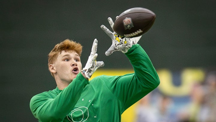 Oregon tight end Terrance Ferguson catches a pass from former Oregon quarterback Bo Nix during Oregon Pro Day Tuesday, March 12, 2024 at the Moshofsky Center in Eugene, Ore. Oregon tight end Terrance Ferguson catches a pass from former Oregon quarterback Bo Nix during Oregon Pro Day Tuesday, March 12, 2024 at the Moshofsky Center in Eugene, Ore.