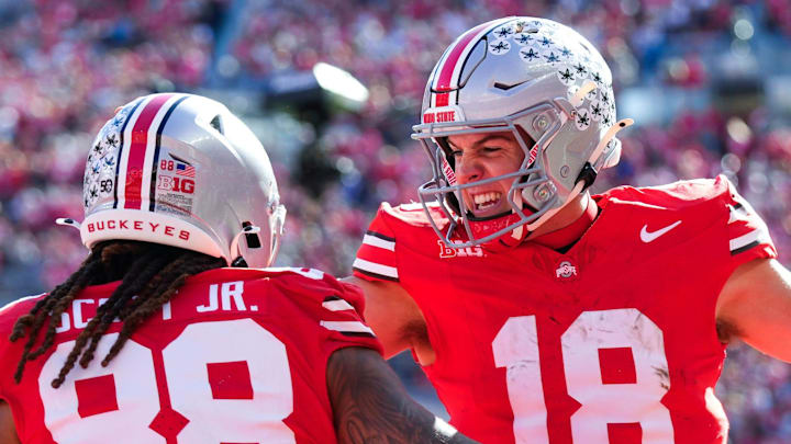 Ohio State Buckeyes quarterback Will Howard (18) celebrates with tight end Gee Scott Jr. (88) after Scott scored a touchdown in the first half at Ohio Stadium on Saturday, Nov. 9, 2024 in Columbus, Ohio.