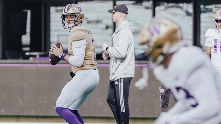 Will Rogers watches his UW receiver make his break.