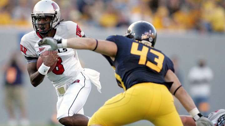 Oct. 9, 2010; Morgantown, WV, USA; UNLV Rebels quarterback Caleb Herring (8) scrambles past West Virginia Mountaineers linebacker Casey Vance (43) during the 3rd quarter at Mountaineer Field at Milan Puskar Stadium. West Virginia defeated UNLV 49-10. Mandatory Credit: Charles LeClaire-USPRESSWIRE Oct. 9, 2010; Morgantown, WV, USA; UNLV Rebels quarterback Caleb Herring (8) scrambles past West Virginia Mountaineers linebacker Casey Vance (43) during the 3rd quarter at Mountaineer Field at Milan Puskar Stadium. West Virginia defeated UNLV 49-10. Mandatory Credit: Charles LeClaire-USPRESSWIRE
