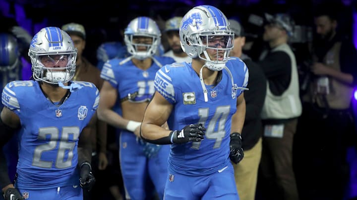 Detroit Lions receiver Amon-Ra St. Brown (14) and running back Jahmyr Gibbs (26) take the field before action against the Chicago Bears at Ford Field, Sunday, Nov. 19, 2023.