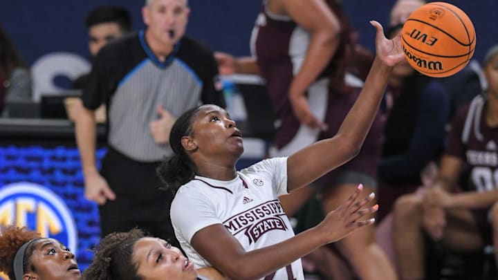 Mar 1, 2023; Greenville, SC, USA; Mississippi State guard Debreasha Powe (21) reaches for a rebound near Texas A&M forward Aaliyah Patty (32) during the first quarter of the SEC Women's Basketball Tournament at Bon Secours Wellness Arena. Mandatory Credit: Ken Ruinard-Imagn Images Mar 1, 2023; Greenville, SC, USA; Mississippi State guard Debreasha Powe (21) reaches for a rebound near Texas A&M forward Aaliyah Patty (32) during the first quarter of the SEC Women's Basketball Tournament at Bon Secours Wellness Arena. Mandatory Credit: Ken Ruinard-Imagn Images