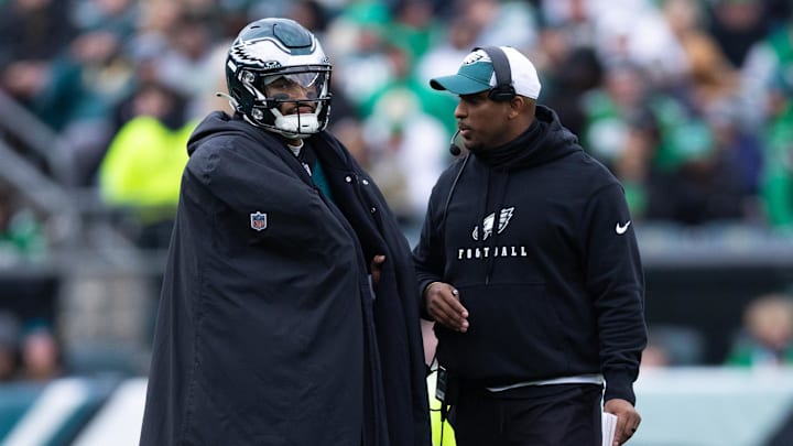 Dec 31, 2023; Philadelphia, Pennsylvania, USA; Philadelphia Eagles quarterback Jalen Hurts (L) and offensive coordinator Brian Johnson (R)