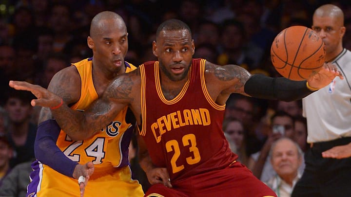 Mar 10, 2016; Los Angeles, CA, USA;  Los Angeles Lakers forward Kobe Bryant (24) guards Cleveland Cavaliers forward LeBron James (23) on the court in the first half of the game at Staples Center. Mandatory Credit: Jayne Kamin-Oncea-Imagn Images