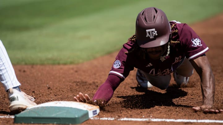 Texas A&M Aggies' Terrence Kiel II (3) dives safely into first base as Auburn Tigers take on Texas A&M Aggies during the SEC baseball tournament at Hoover Met in Birmingham, Ala., on Thursday, May 22, 2025. Texas A&M Aggies' Terrence Kiel II (3) dives safely into first base as Auburn Tigers take on Texas A&M Aggies during the SEC baseball tournament at Hoover Met in Birmingham, Ala., on Thursday, May 22, 2025.