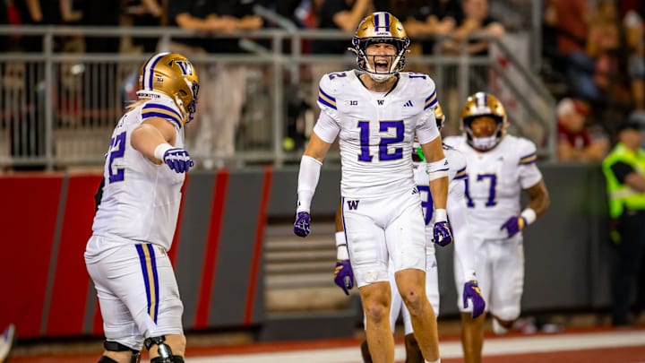 Alex McLaughlin celebrates his 47-yard interception return for a touchdown in the Apple Cup. 