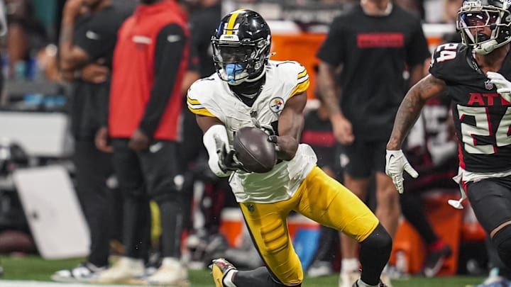 Sep 8, 2024; Atlanta, Georgia, USA; Pittsburgh Steelers wide receiver George Pickens (14) makes a catch in front of Atlanta Falcons cornerback A.J. Terrell (24) at Mercedes-Benz Stadium. Mandatory Credit: Dale Zanine-Imagn Images