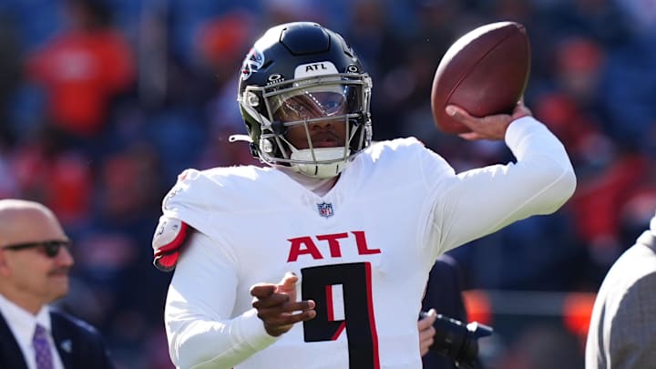 Nov 17, 2024; Denver, Colorado, USA; Atlanta Falcons quarterback Michael Penix Jr. (9) warms up before the game against the Denver Broncos at Empower Field at Mile High.  