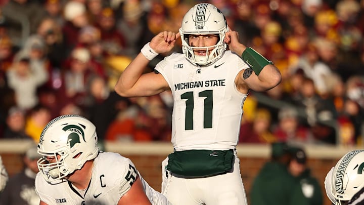 Nov 1, 2025; Minneapolis, Minnesota, USA; Michigan State Spartans quarterback Alessio Milivojevic (11) calls a play against the Minnesota Golden Gophers during the second half at Huntington Bank Stadium. Mandatory Credit: Matt Krohn-Imagn Images
