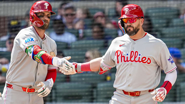 Apr 26, 2026; Cumberland, Georgia, USA; Philadelphia Phillies left fielder Kyle Schwarber (right) reacts with first baseman Bryce Harper (3) after hitting a home run against the Atlanta Braves during the eighth inning at Truist Park.