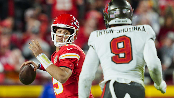 Nov 4, 2024; Kansas City, Missouri, USA; Kansas City Chiefs quarterback Patrick Mahomes (15) throws a pass against Tampa Bay Buccaneers linebacker Joe Tryon-Shoyinka (9) at GEHA Field at Arrowhead Stadium. Mandatory Credit: Jay Biggerstaff-Imagn Images