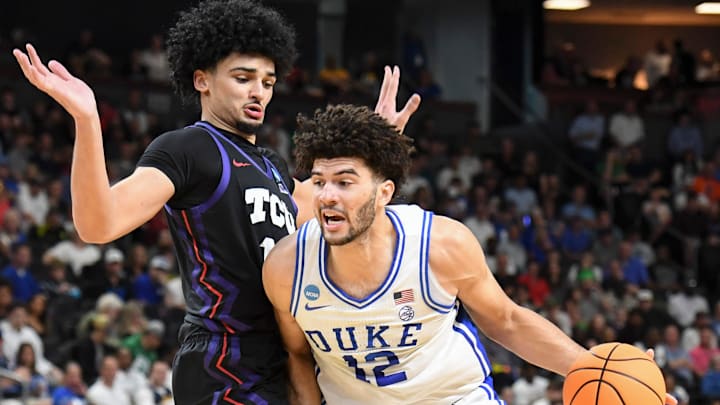 TCU Horned Frogs forward David Punch (15) defends Duke Blue Devils forward Cameron Boozer (12) Saturday, March 21, 2026, during the NCAA Men’s Basketball Tournament second round game at Bon Secours Wellness Arena in Greenville, South Carolina. TCU Horned Frogs forward David Punch (15) defends Duke Blue Devils forward Cameron Boozer (12) Saturday, March 21, 2026, during the NCAA Men’s Basketball Tournament second round game at Bon Secours Wellness Arena in Greenville, South Carolina.