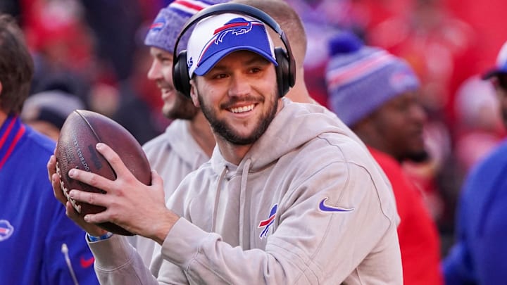 Buffalo Bills quarterback Josh Allen (17) smiles toward the sidelines against the Kansas City Chiefs prior to a game at GEHA Field at Arrowhead Stadium.