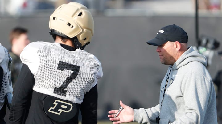 Purdue Boilermakers defensive back Crew Wakley (7) talks to head coach Barry Odom Purdue Boilermakers defensive back Crew Wakley (7) talks to head coach Barry Odom