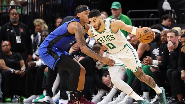 Boston Celtics forward Jayson Tatum (0) is guarded by Orlando Magic forward Paolo Banchero (5) in the second quarter during game four of first round for the 2025 NBA Playoffs at Kia Center.