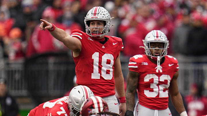 Ohio State Buckeyes quarterback Will Howard (18) signals to his offense during the second half of the NCAA football game against the Indiana Hoosiers at Ohio Stadium in Columbus on Saturday, Nov. 23, 2024. Ohio State won 38-15.