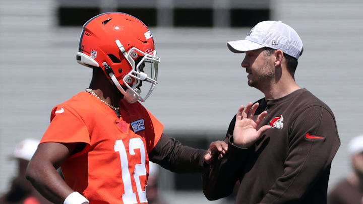 Cleveland Browns quarterback Shedeur Sanders (12) works with offensive coordinator Tommy Rees during NFL rookie minicamp at the Cleveland Browns training facility on Friday, May 9, 2025, in Berea, Ohio.